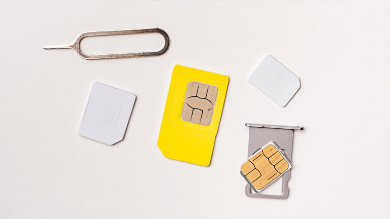 A collection of physical SIM cards, SIM cards plate, and SIM pins 
