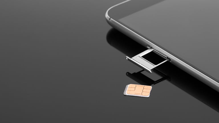 A SIM card plate is out from mobile device and a SIM card is taken out