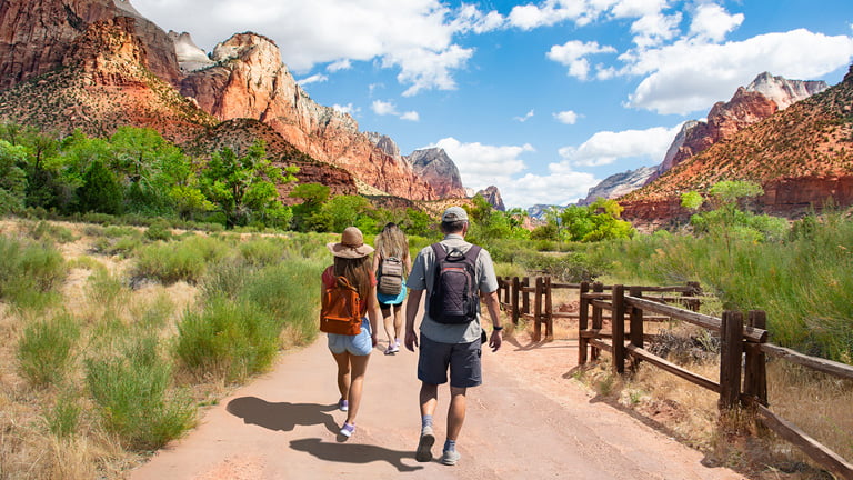 A-group-of-travelers-hiking-and-packed-with-travel-hacks-for-USA-travelers